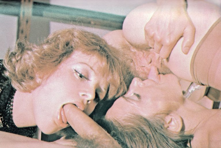 Vintage retro classic porn scene featuring blowjobs and oral sex, nostalgic adult entertainment image